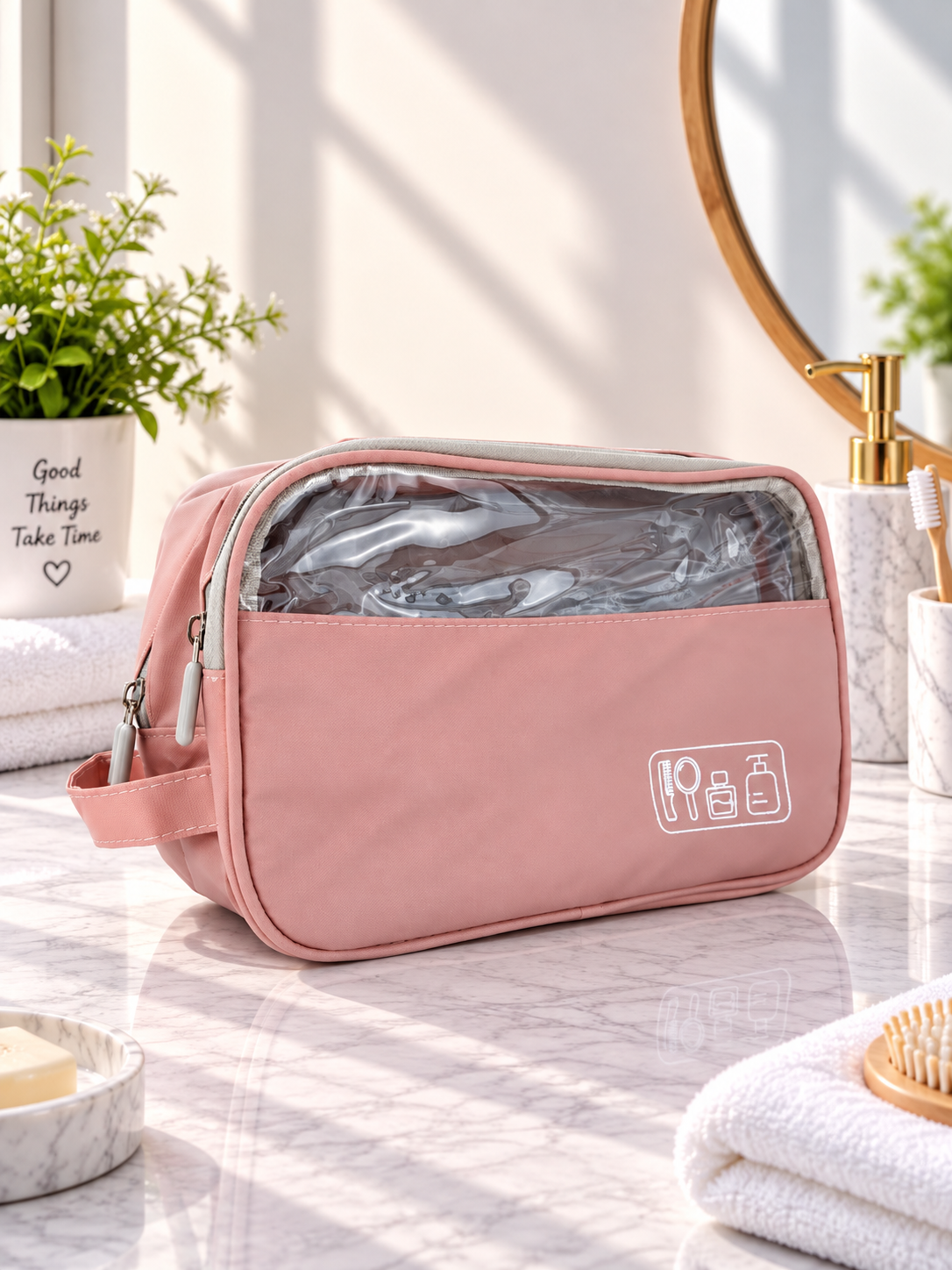 Pink travel toiletry bag with clear zip window and front logo patch